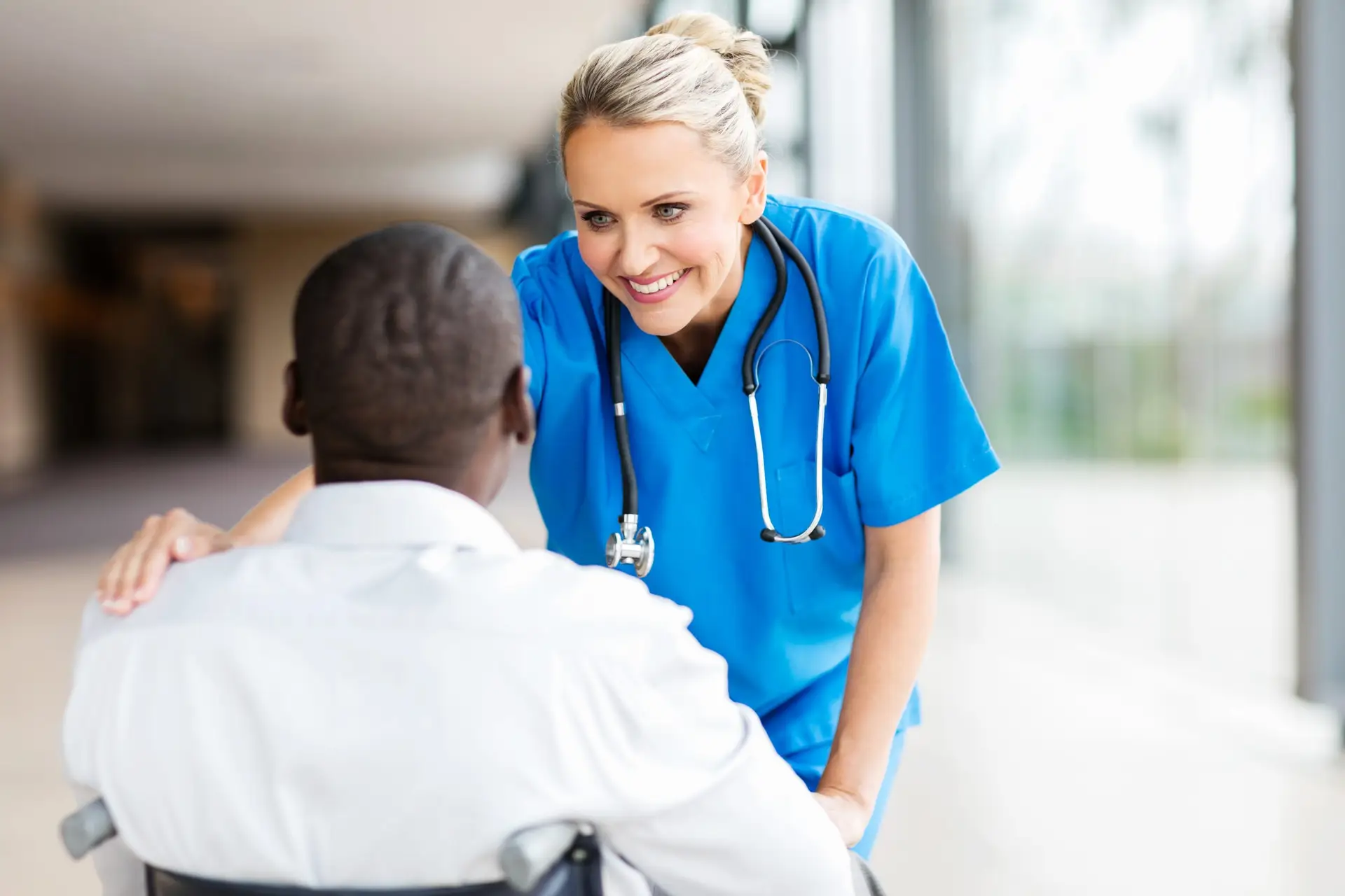 female doctor comforting disabled patient