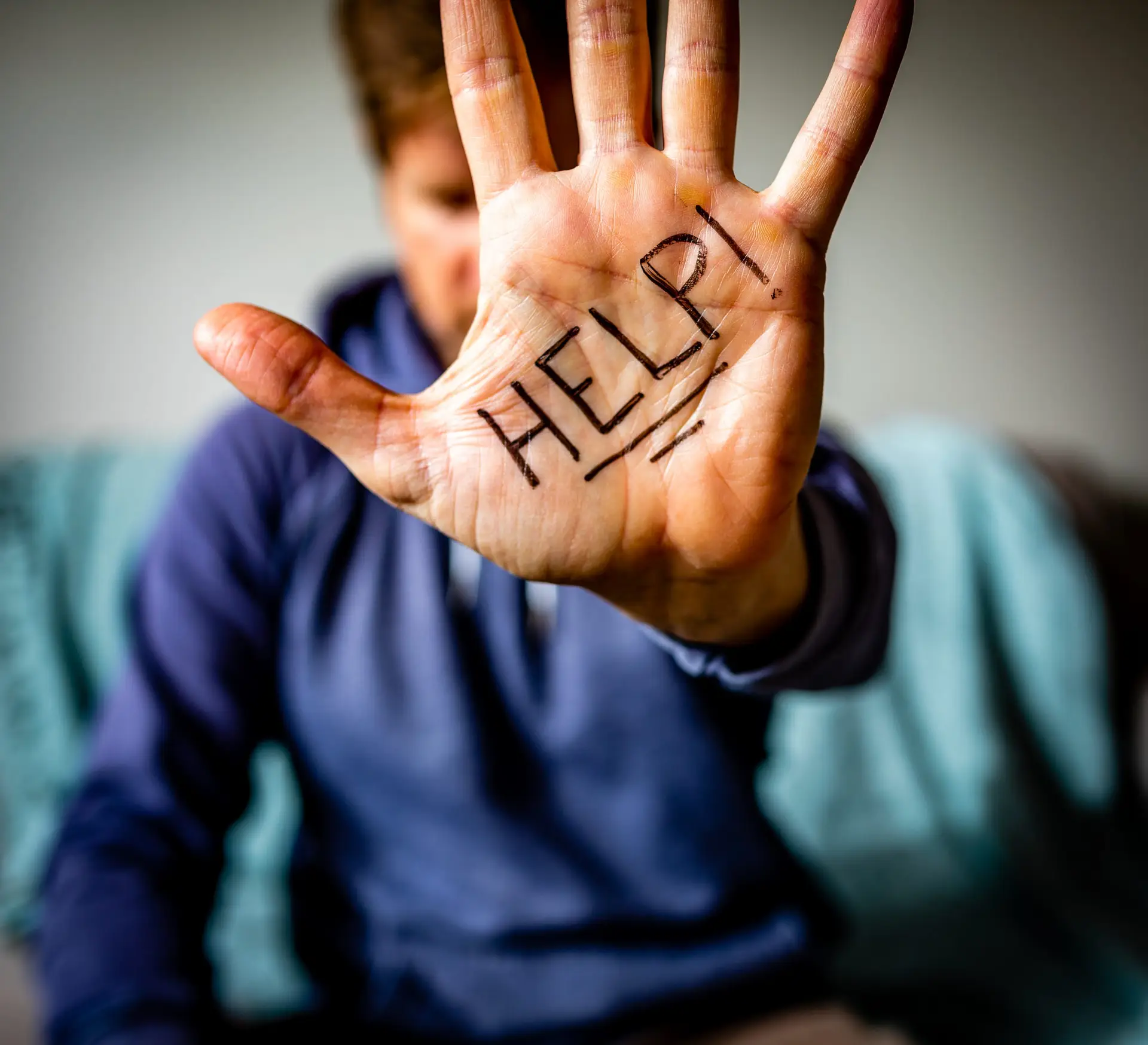 Help Written on Man's Palm