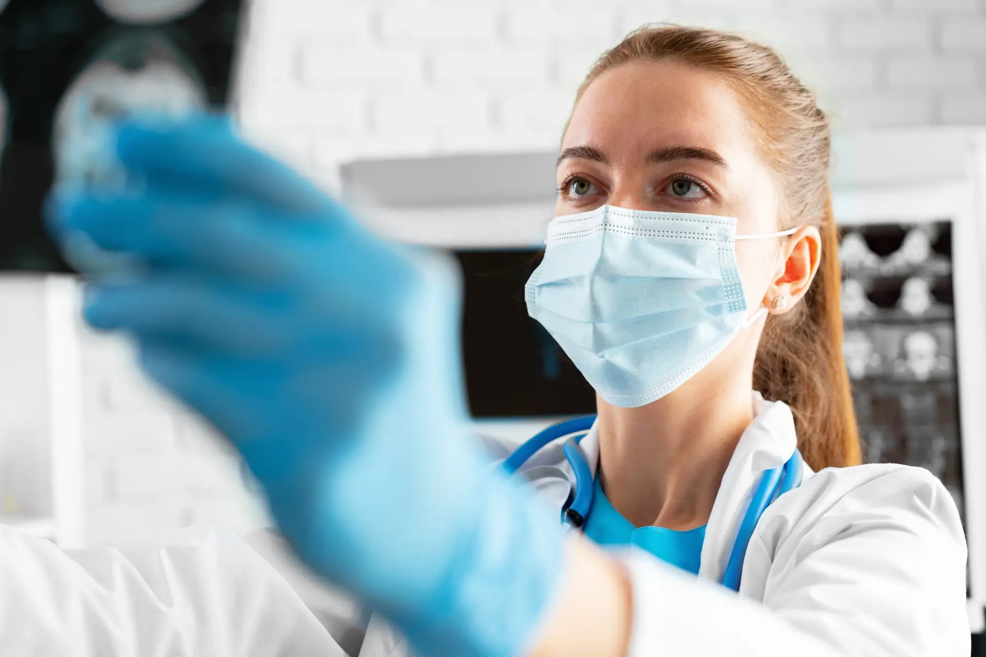 Woman doctor examines head mri scan in hospital